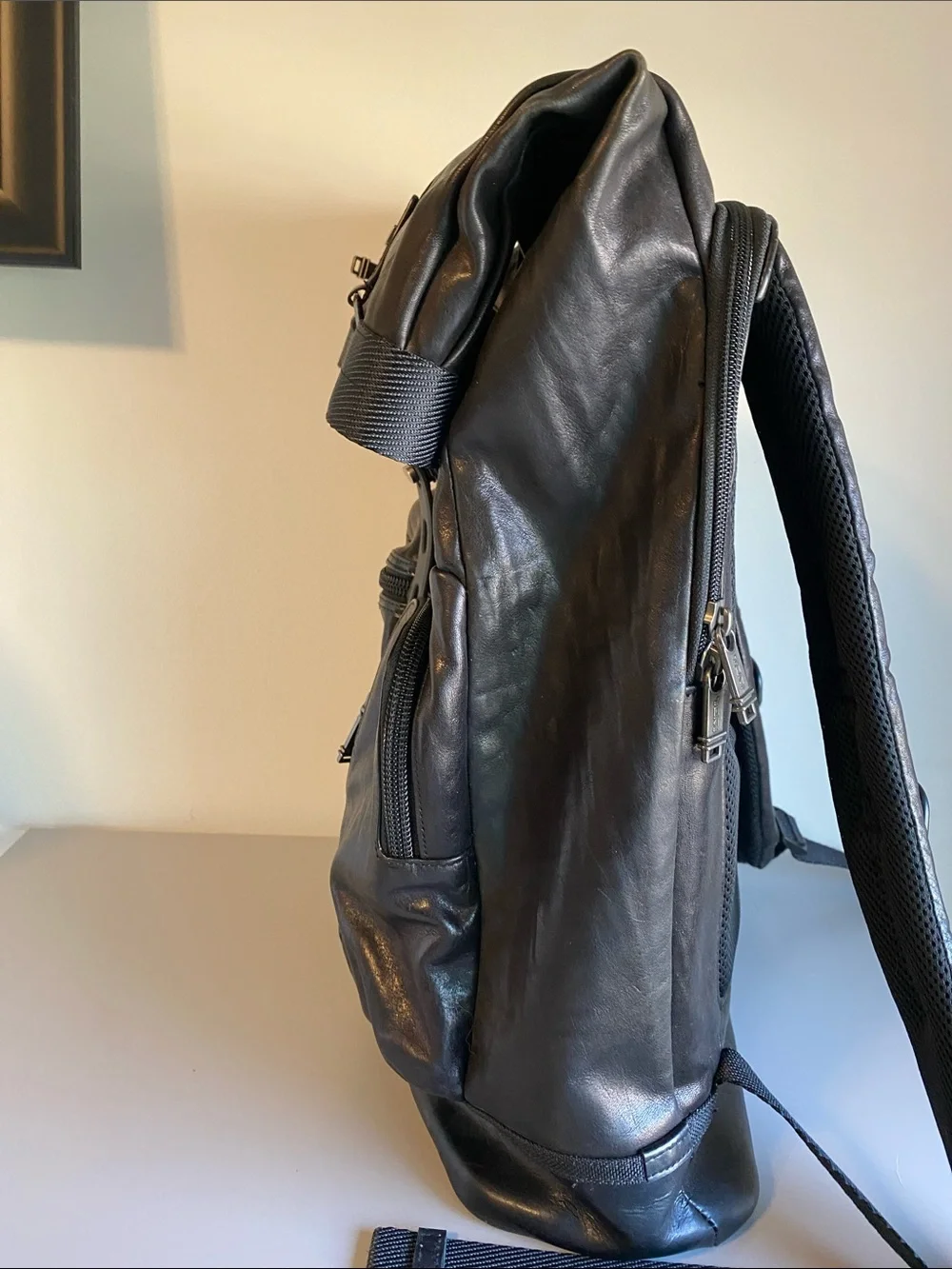 Tumi Black Leather Roll-Top Backpack with Front Pockets